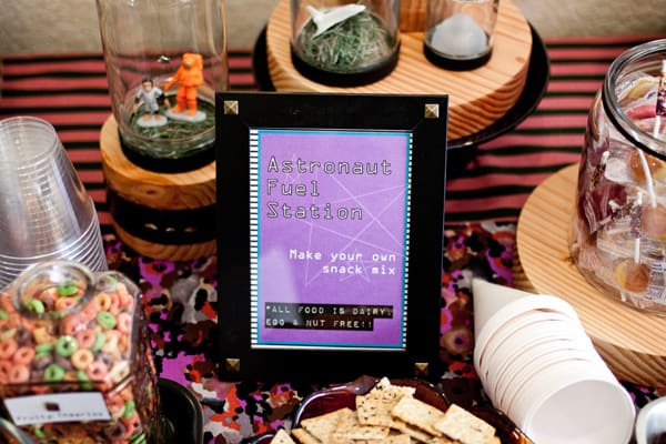 Close up of a party table with a space theme.