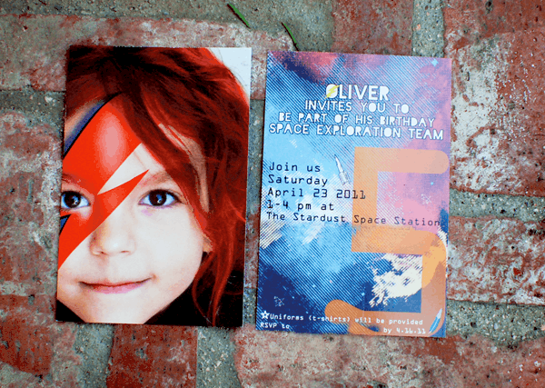 Close up of a party invitation for a kid\'s Ziggy Stardust space-themed birthday party. 