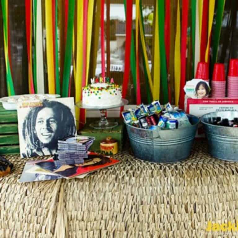 A party table for a kid's party with a Bob Marley theme.