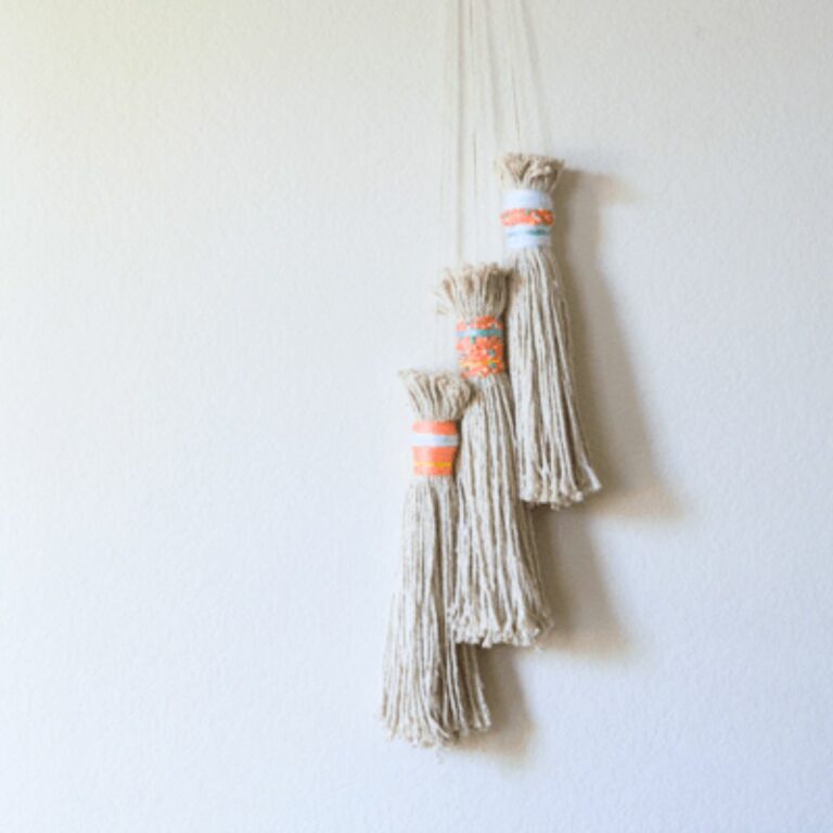 3 large tassels made from mop heads for party or home decoration.