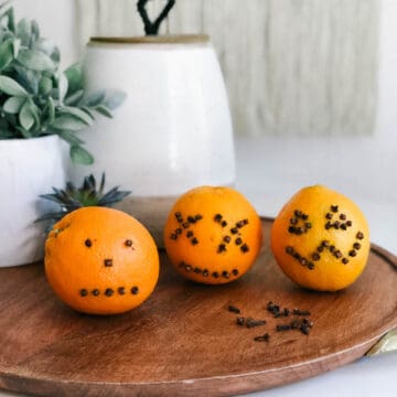 oranges with cloves stuck in to look like pumpkin faces