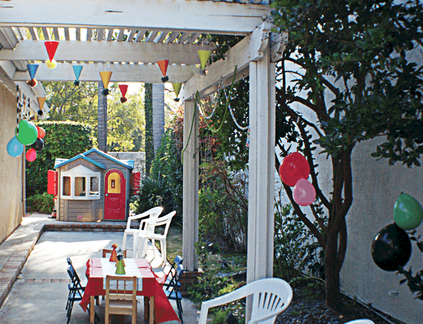 A backyard decorated for a kid's party.