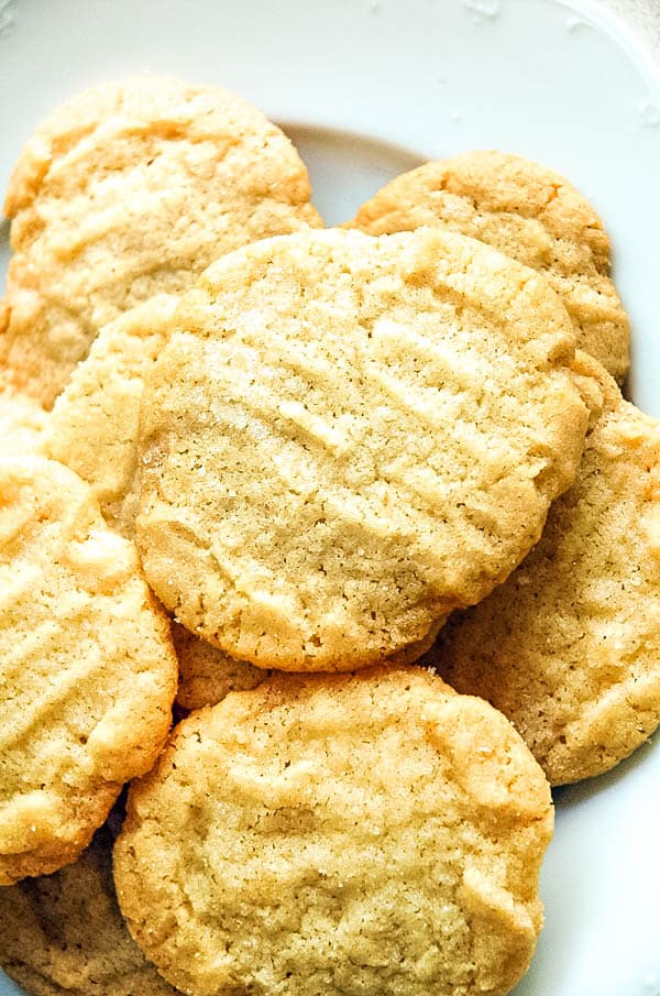 A bunch of mayo cookies on a plate.