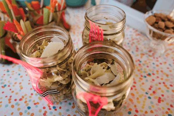 Salads in a jar on a table. 