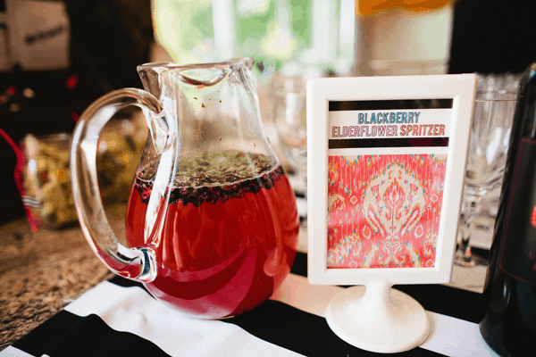 A pitcher with a blackberry cocktail for a bridal shower.