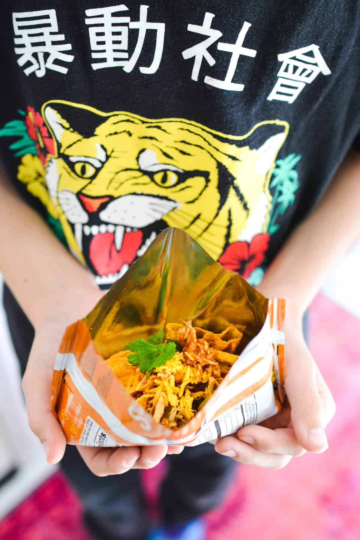 Kid holding a taco in a bag for an easy dinner.