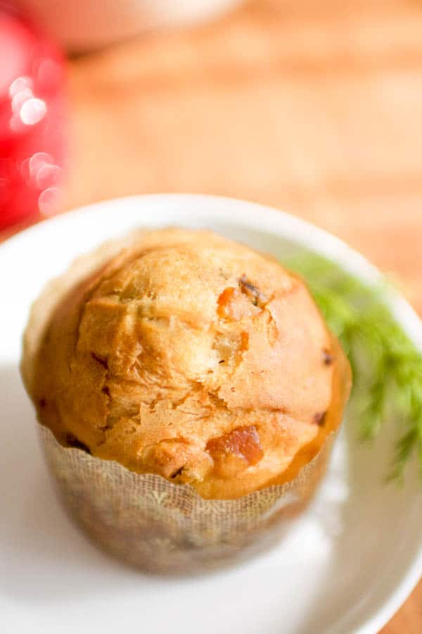 Overhead view of a mini panettone on a plate. 