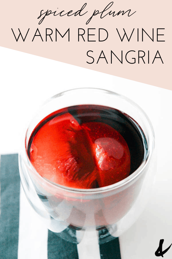 warm red sangria on a table with text overlay