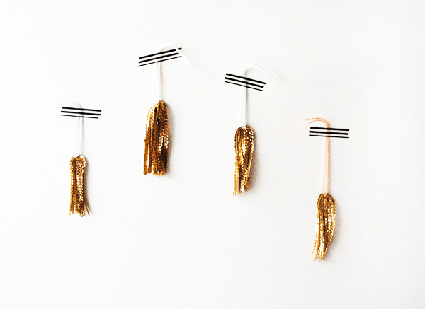 This tassel DIY is simple and can be used for all kinds of things like making present toppers, party decorations and more!