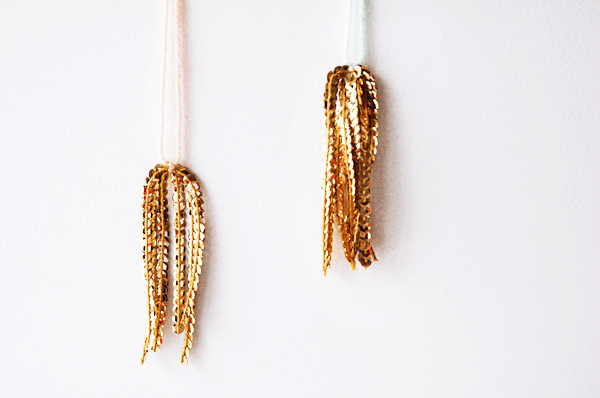 These gold sequin tassels are simple and inexpensive to make. They would be perfect for a girl's party decoration idea! 