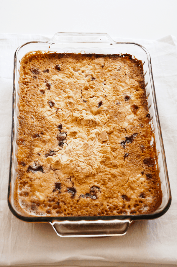 A glass baking dish with homemade Cherry Pineapple Dump Cake. 