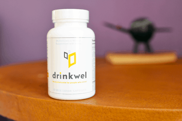 A bottle of Drinkwel on a table. 