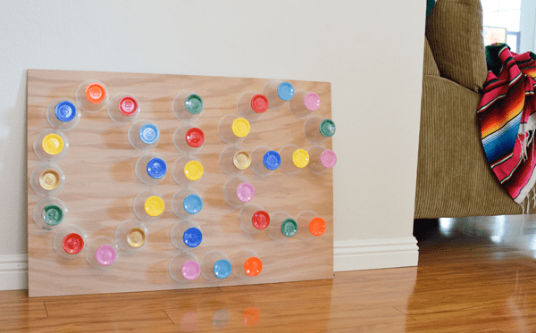 Mexican-inspired sign made with wood and painted plastic cups for a girls night in theme.