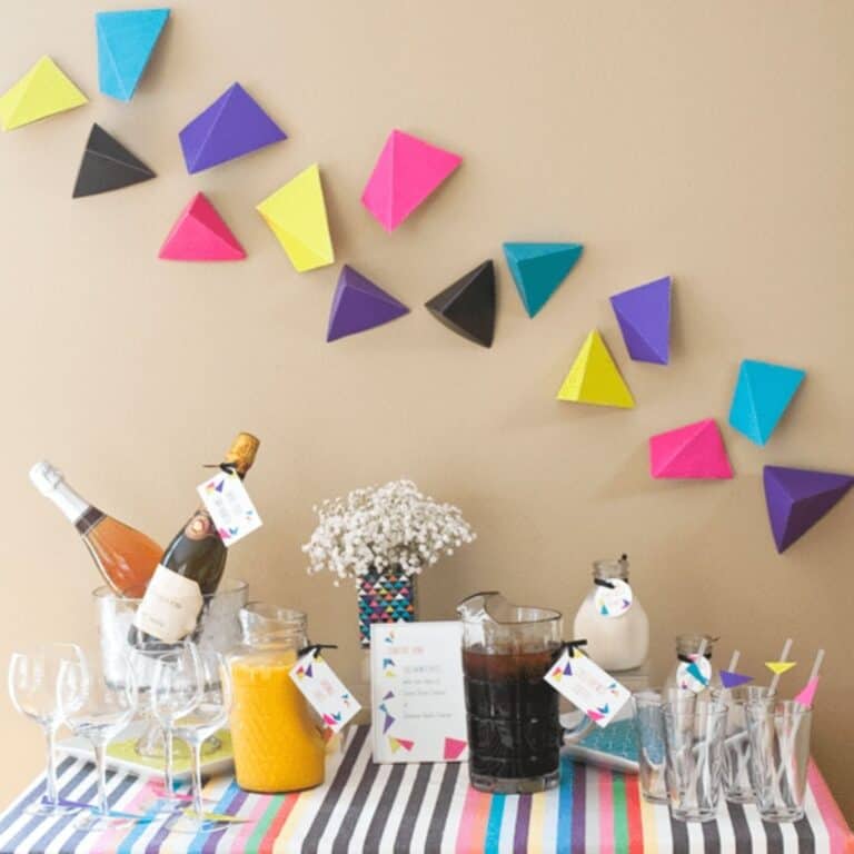 Decorated buffet table for a back to school party for adults with champagne.
