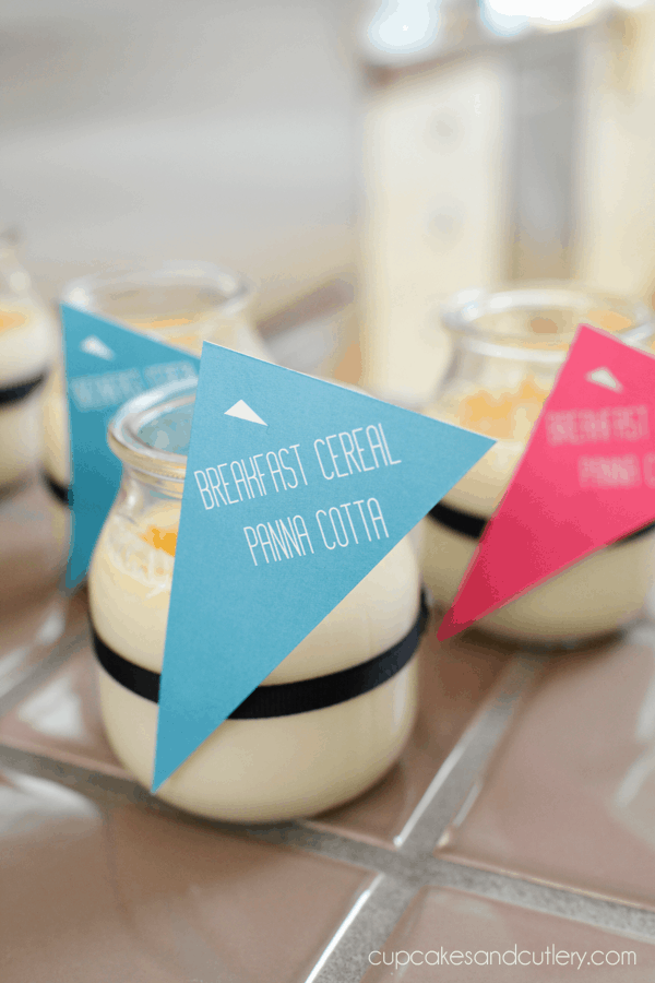 Small jars holding panna cotta made with cereal milk for a back to school brunch menu. 