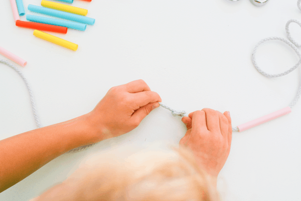 Straw and knot garlands are party decor kids can help with.  A good way to help them learn to knot and also good for hand eye coordination.