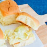 Artichoke Dip Sliders on a cutting board