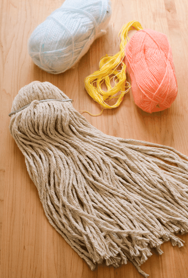 DIY extra large tassel with mop head and embroidery thread and yarn. 