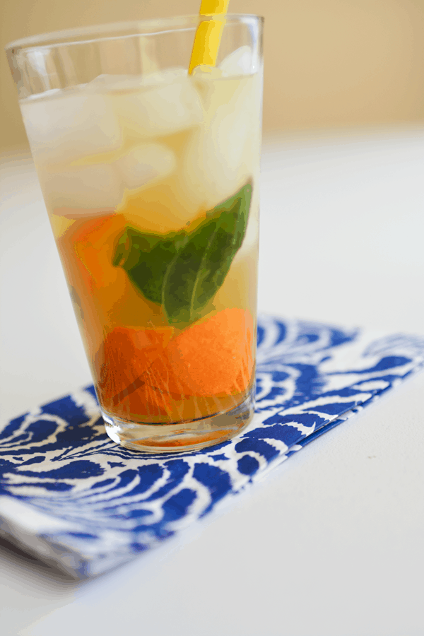 Muddle tangerine and basil in water. I promise you will be drinking this all summer long. // www.cupcakesandcutlery.com