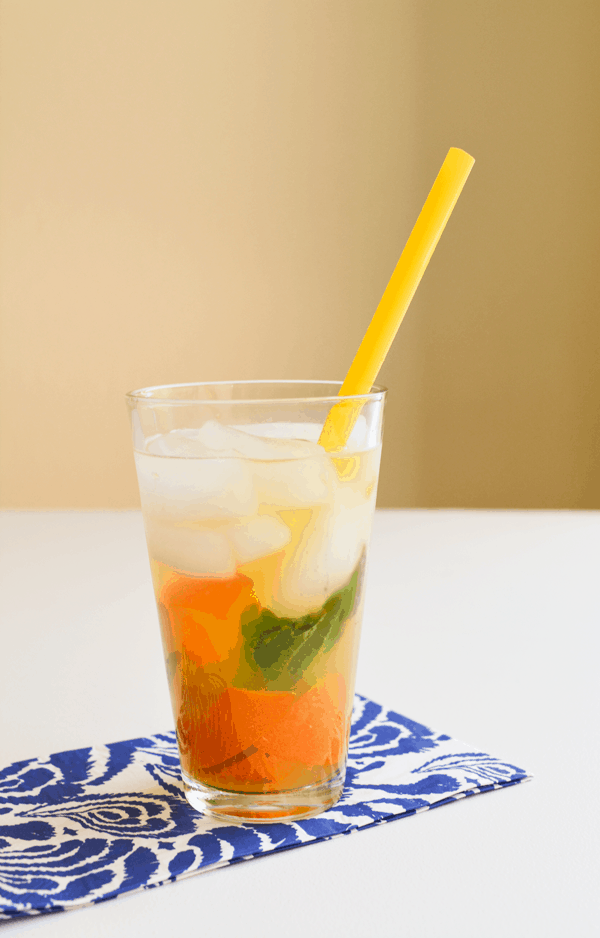 Muddled tangerine and basil infused water for summer. // www.cupcakesandcutlery.com