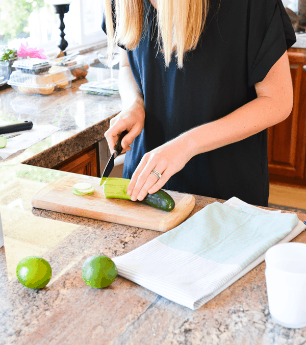 Cutting cucumber for a vodka cocktail. 