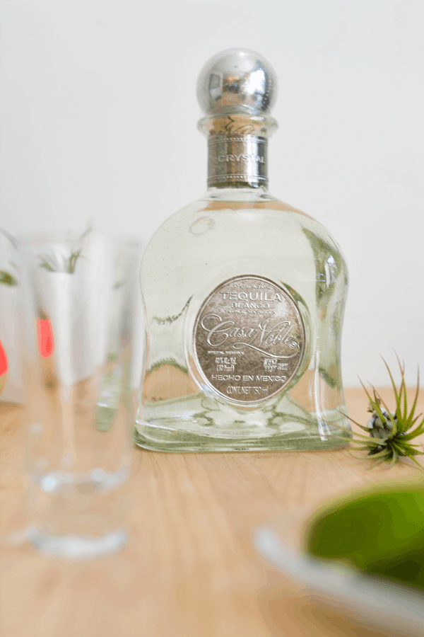 Bottle of tequila on a table.