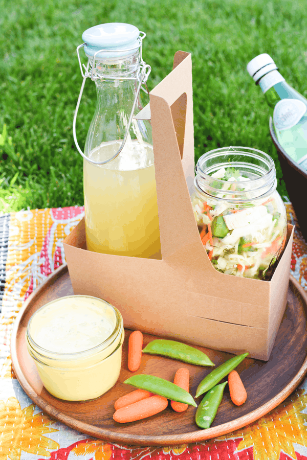 Lavender lemonade in a serving jar at a picnic! 