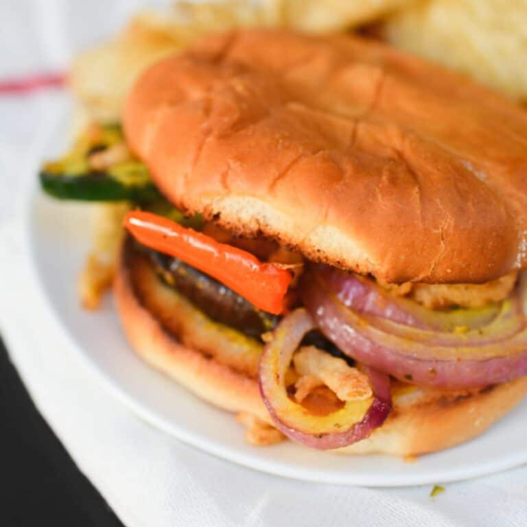 A grilled vegetable sandwich on a plate.