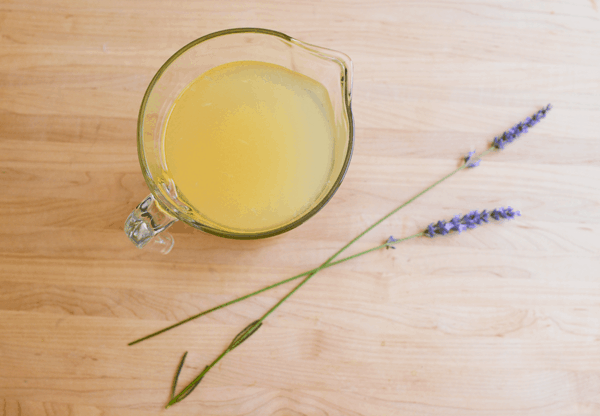 overhead view of Lavender Lemonade in a pitcher on a wooden table