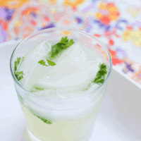 Limeade and cilantro make this gin cocktail super refreshing. The sparkling wine adds a little fun! // www.cupcakesandcutlery.com