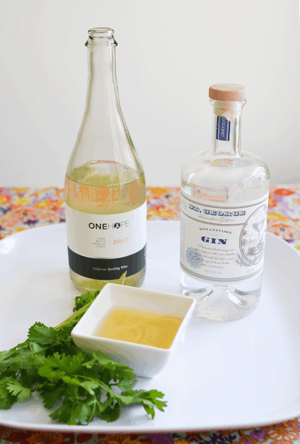 Ingredients to make a refreshing gin cocktail topped with One Hope Wine sparkling wine!