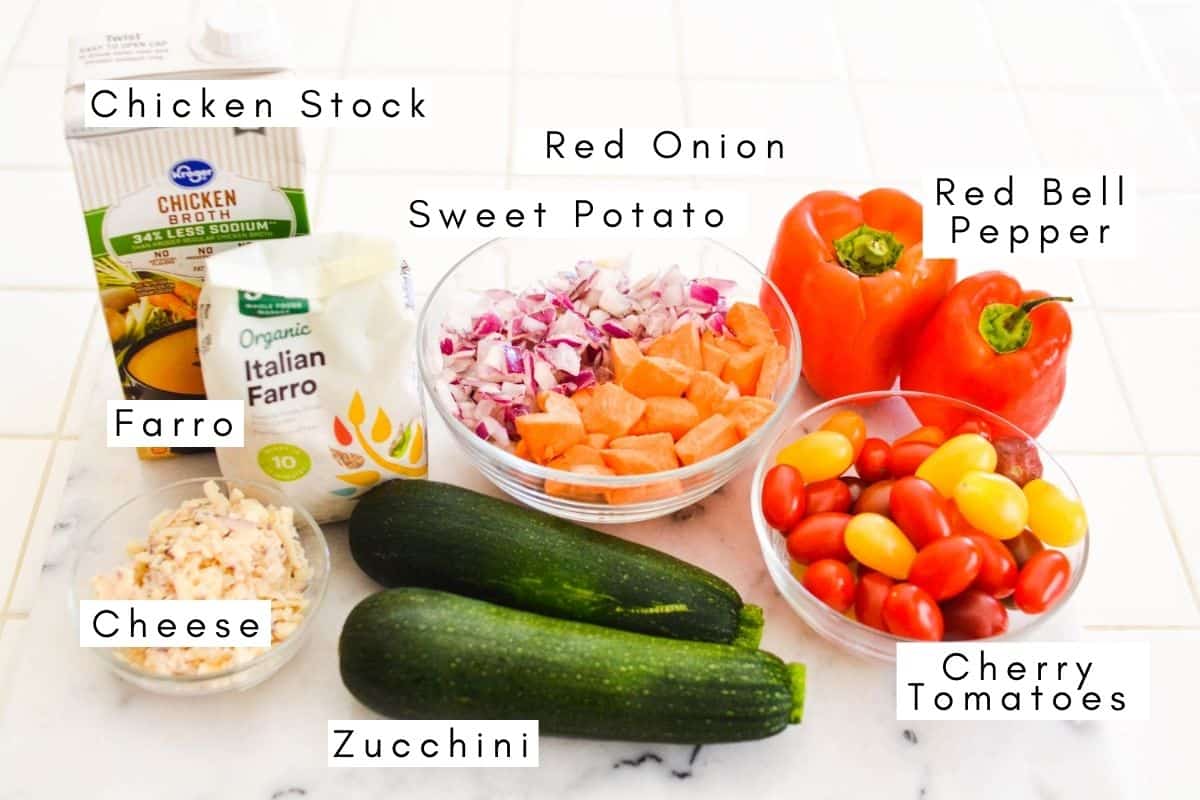 Labeled ingredients to make a farro bowl on a counter.