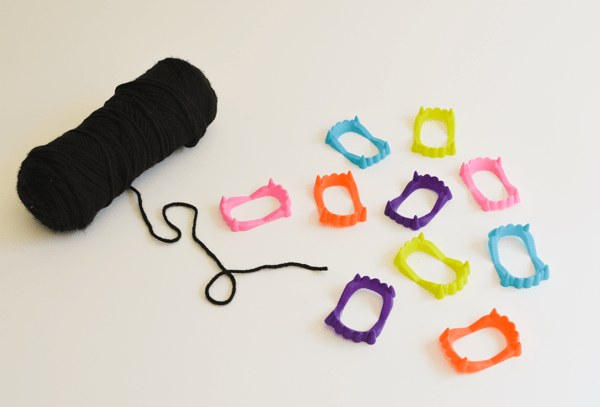 Bright colored plastic fangs for an easy Halloween garland.