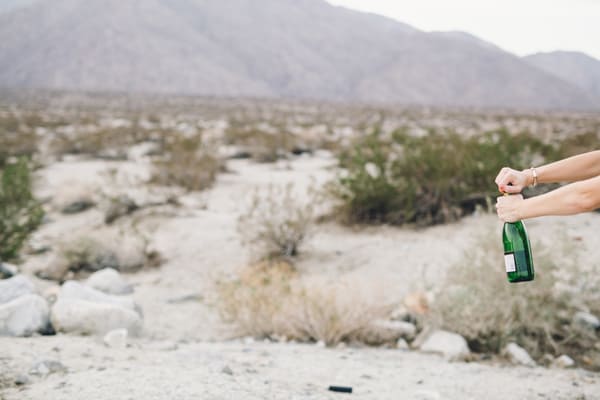 Popping champagne in the desert to make my favorite champagne punch recipe.