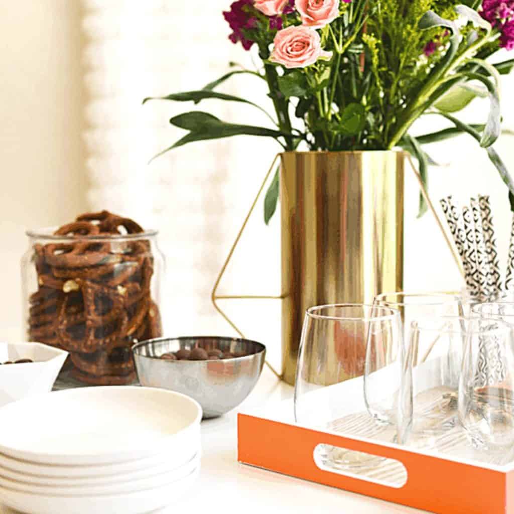 Close up of a spring party table with a vase of flowers.