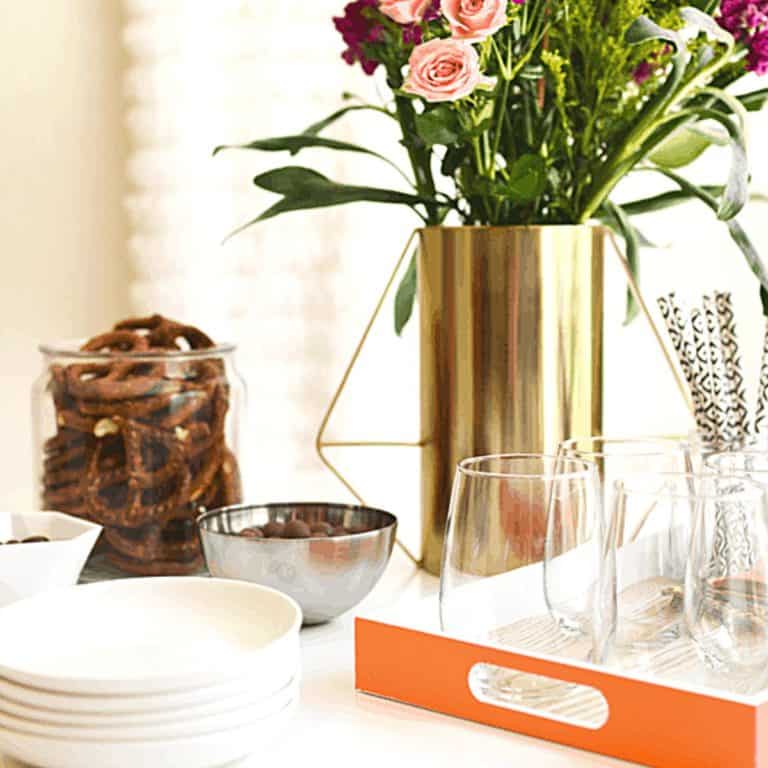 Close up of a spring party table with a vase of flowers.