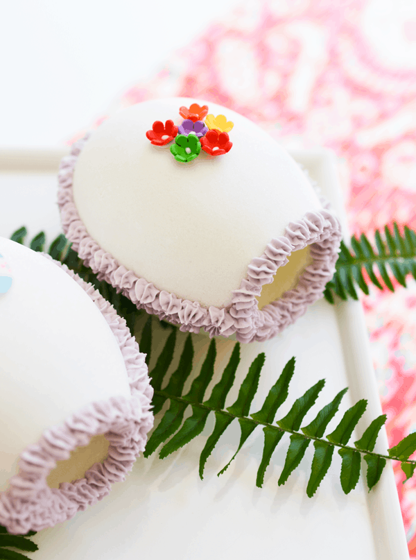 Easter Sugar Eggs on a table with sugar flowers on top.