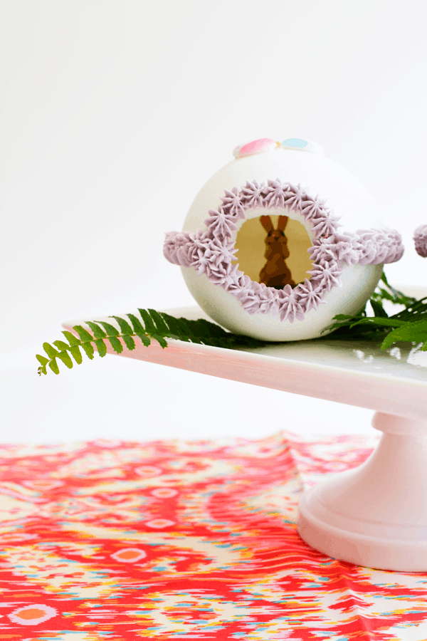 Front view of a Panoramic Easter Egg on a cake plate.