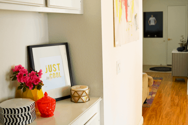 a styled shelf in a hallway of a home