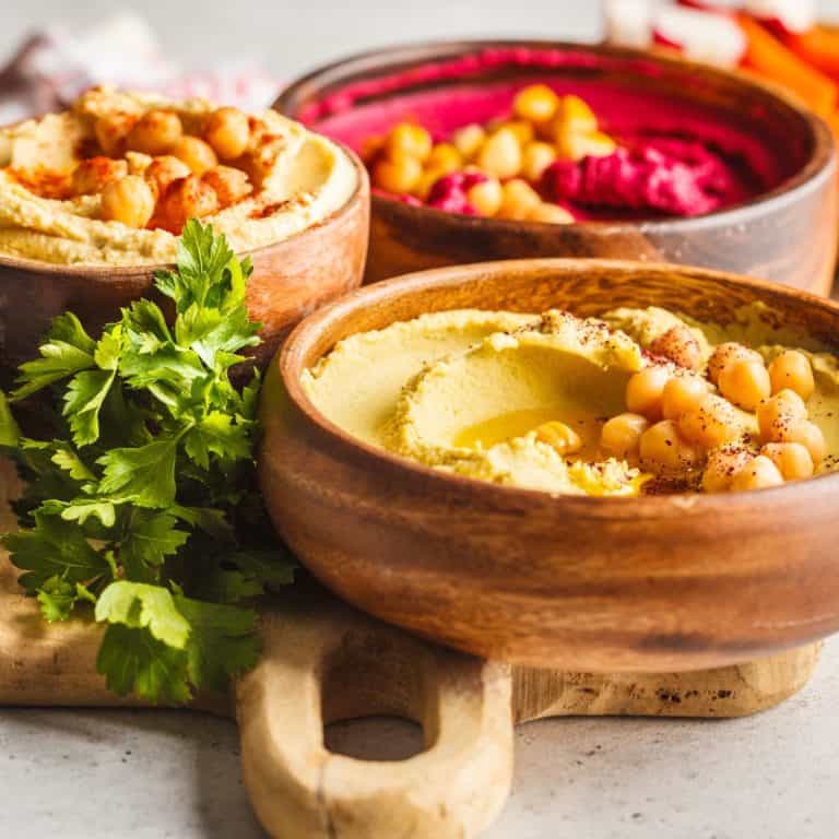 A delectible spread of hummus for a party.