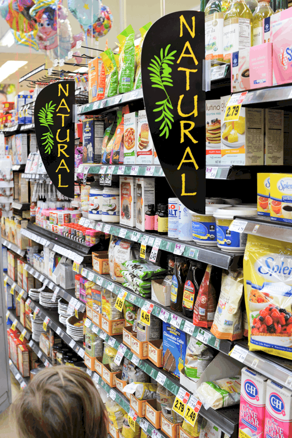 A natural products section of an aisle at the grocery store.