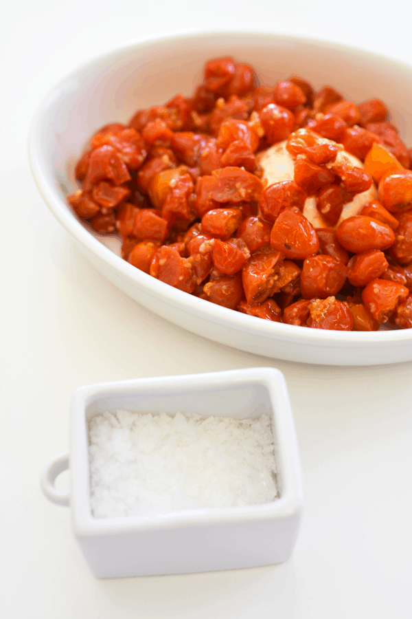 Burrata and tomato appetizer, along with sea salt, make a great easy recipe.
