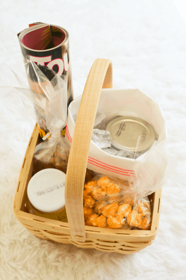 A bad day care package in a wooden basket on a table. 