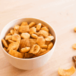 It's not the holidays without everyone's favorite snack, Chex Mix! I changed up the seasoning a little and it's crazy flavorful. You're mouth will thank you!