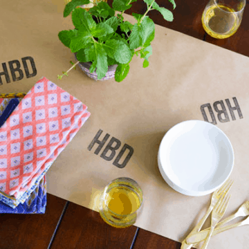 Make this easy birthday table runner! Use a store-bought stamp or a custom one for a personalized DIY party decoration. This could work for the holidays too!