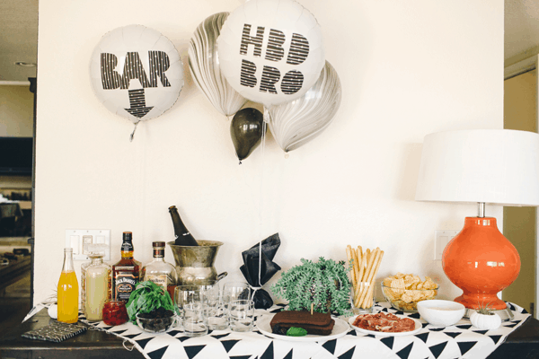 DIY Balloon Signs for a party that show where the bar is and wish someone a happy birthday.