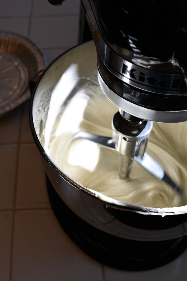 Cake batter being mixed in a stand mixer. 