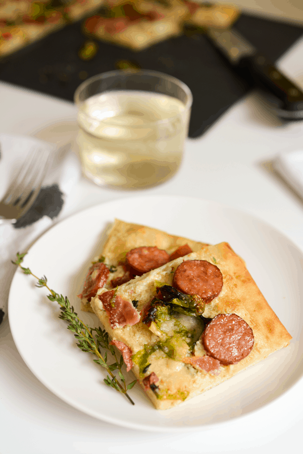 This pizza is delicious! The goat cheese spread makes the perfect base for the sausage, bacon, Brussels sprouts and parmesan. #WildSideofFlavor #ad