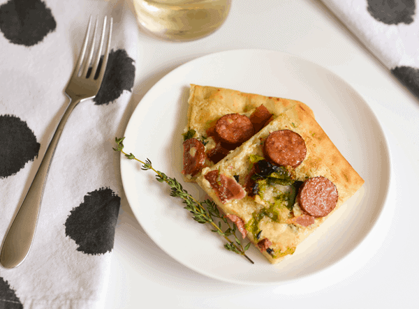 Try this yummy goat cheese pizza with bacon, Brussels Sprouts, sausage and parmesan. This flatbread pizza takes only a few minutes to put together and 8 minutes to bake! 