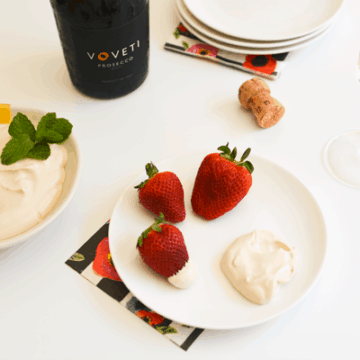 I love this simple strawberry dessert idea! Serve fresh strawberries with a yummy dip of whipped cream, vanilla, brown sugar and sour cream! Pair it with prosecco for a fabulous treat!